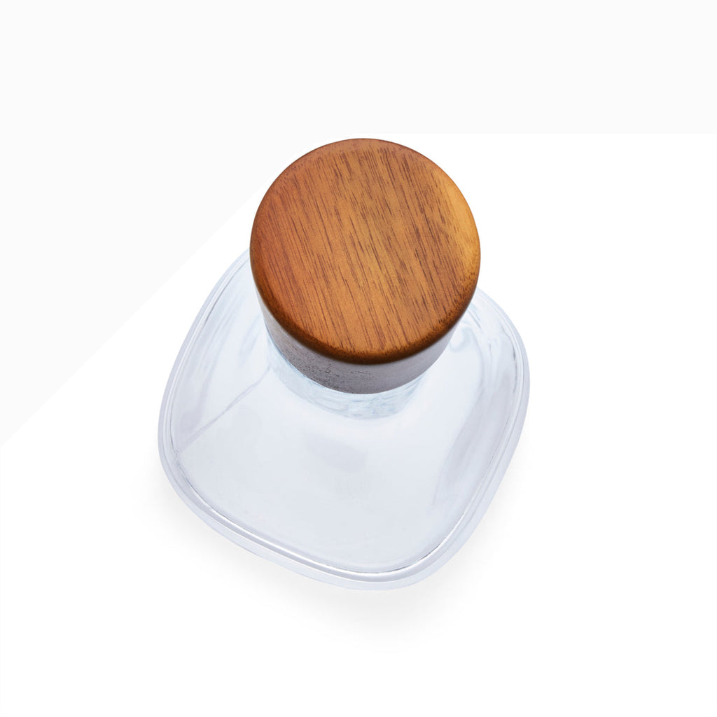 Update the classic bar with contemporary design. The combination of the Vie Decanter’s square, glass body and rounded, wood stopper make this piece a style-standout. Fill with wine, whiskey, or any other spirit and set out on your bar to be admired.