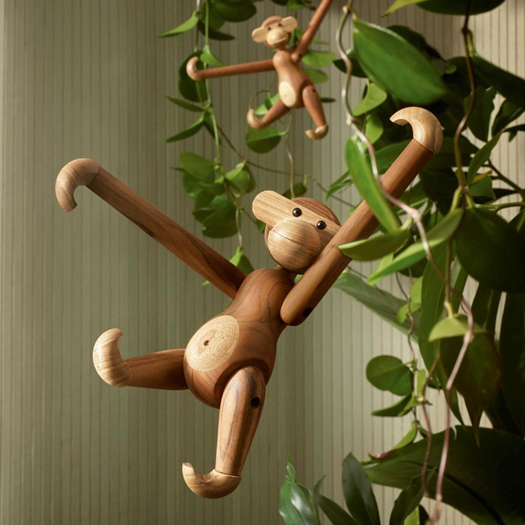 The monkey is available in small, medium and large versions. Common to them all is that they are original wood creations. Kay Bojesen always gave his wooden figures a special soul. Each one also got its own story, and with their smiling lines, unique shapes and vibrant wood they have survived many generations.