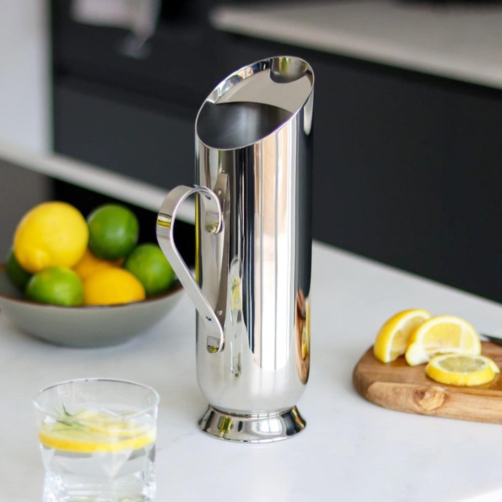 TROMBONE WATER PITCHER - SKU NM00161. Originally designed by Nick Munro and recently improved for stability and beauty. It is the perfect lemonade jug for al fresco dining and an ideal vessel for water in any dinner setting.