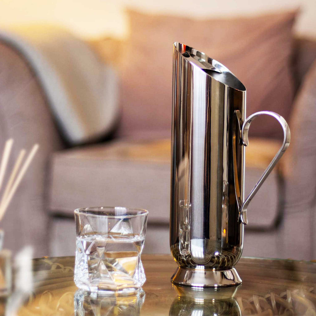 Trombone water pitcher made from 18/8 polished stainless steel with ice dam and non-drip spout. Dishwasher safe. 