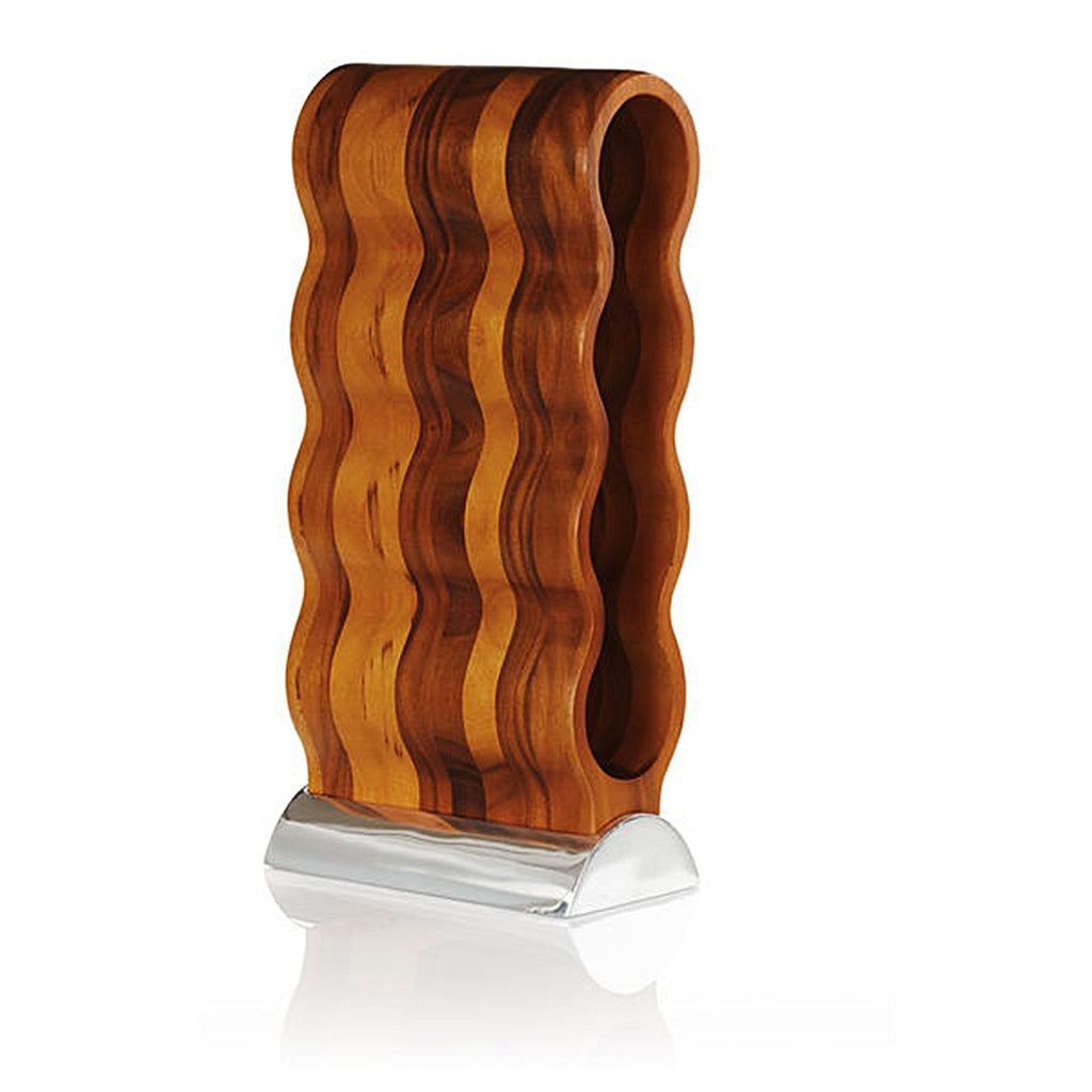 Resting on its Nambé Alloy base, the Curvo Wine Rack’s acacia wood form curves rhythmically to create spaces for four wine bottles. 