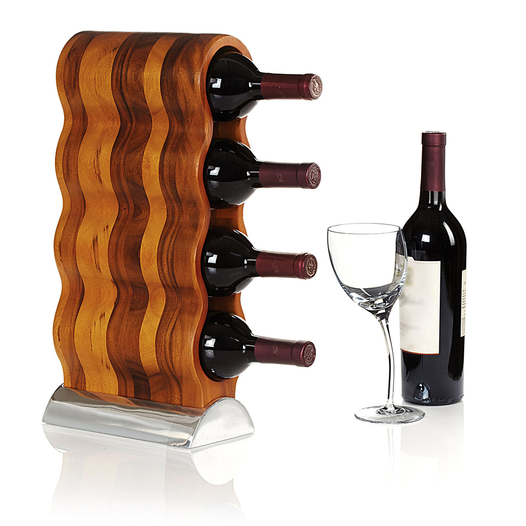 Resting on its Nambé Alloy base, the Curvo Wine Rack’s acacia wood form curves rhythmically to create spaces for four wine bottles. A beautiful and functional art piece, it can be displayed from the side or the front for two distinct effects.