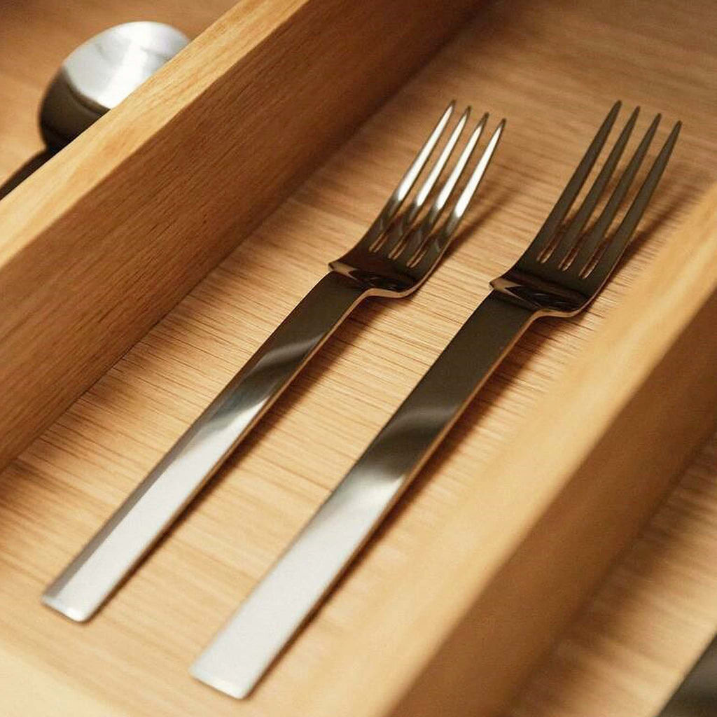 Odeon table fork. SKU 2520405. Introduced in 1986 it remains one of our most popular ranges. Overtones of Art Deco and 1920s Bauhaus architecture give Odeon its simplicity of line and purist feel. Width (mm): 23. Length (mm): 197. Material: 18/10 stainless steel