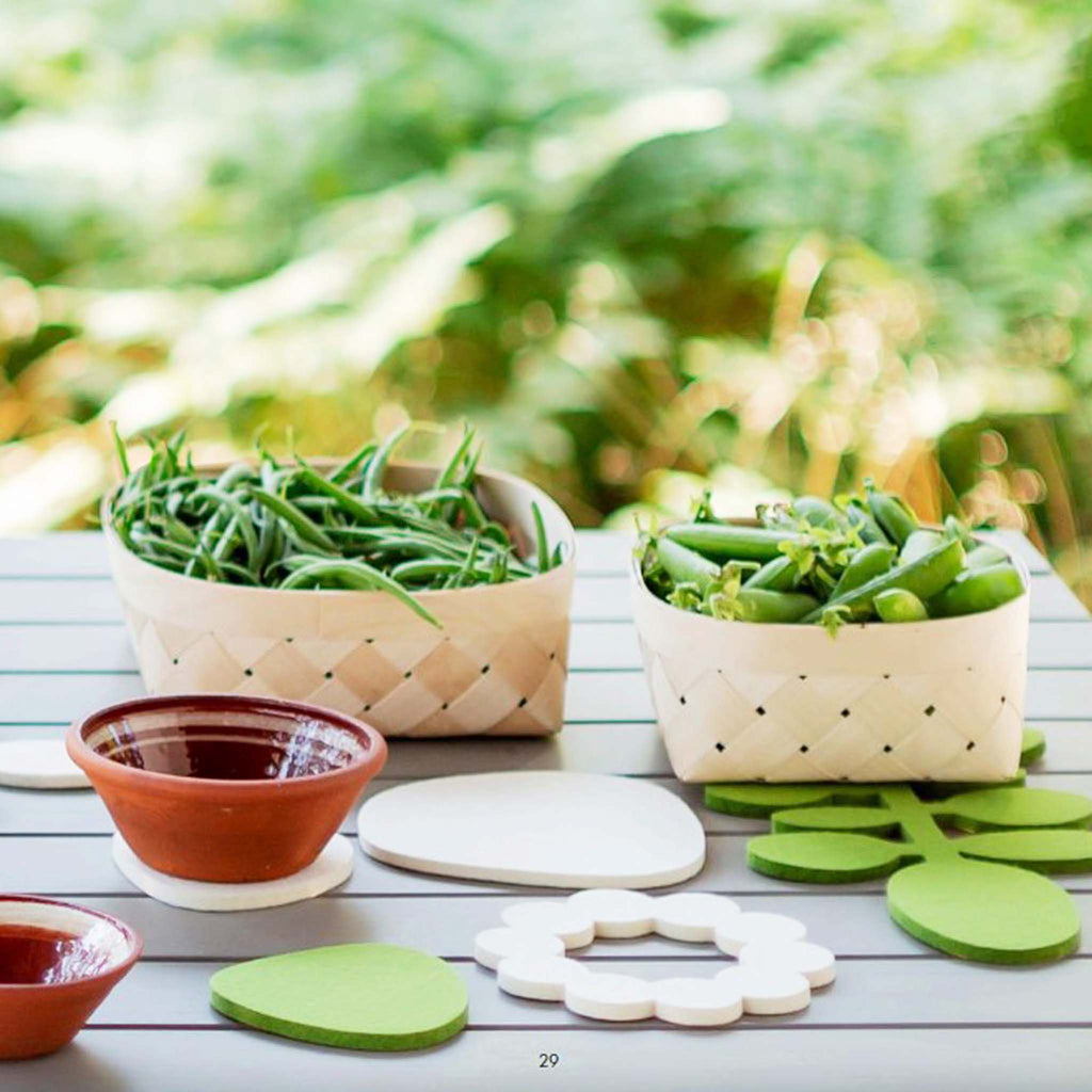 Verso Design Papu (Bean) long wool-felt trivet in green UP3-07. Verso’s Papu trivets add artistry to the table. Most trivets get put away after the meal, but these are beautiful enough for everyday display.