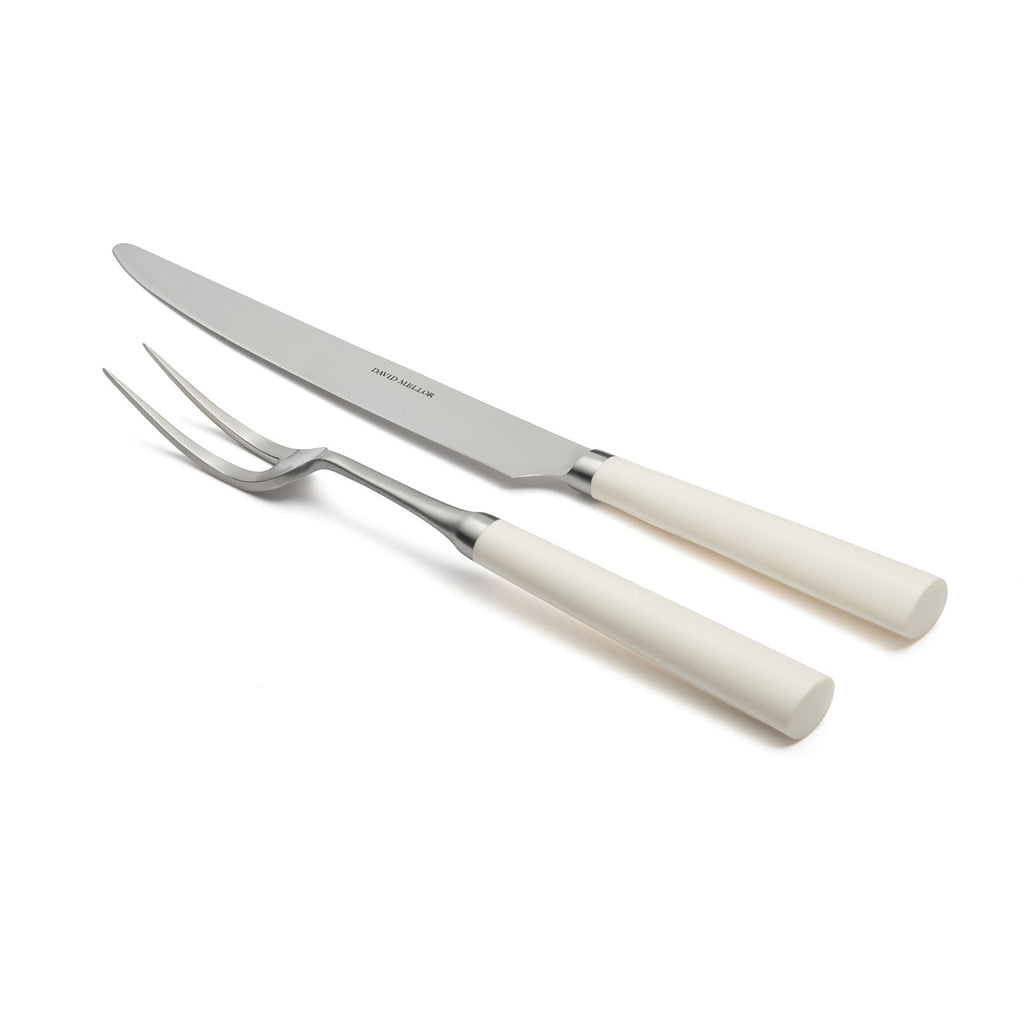 David Mellor Pride carving set. SKU 2518310. New edition of David Mellor’s famous ‘Pride’ carving set first designed in 1956. Expertly hand finished with ivory coloured handles. Super-sharp high carbon stainless steel blade has been ice-hardened to minus 80ºc. Carving Knife 20cm. Carving Fork 25.5cm.
