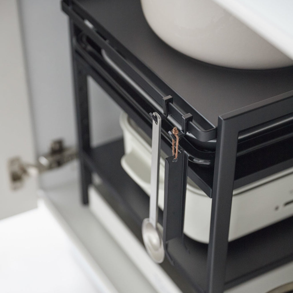 This 3 tier kitchen storage rack is the key to cabinet organization! Make the most of vertical storage space with its adjustable shelves and hooks. Customize to suit your storage needs.