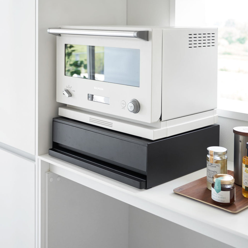 Reclaim the precious countertop space your kitchen appliances are hogging with this unique two-way drawer.