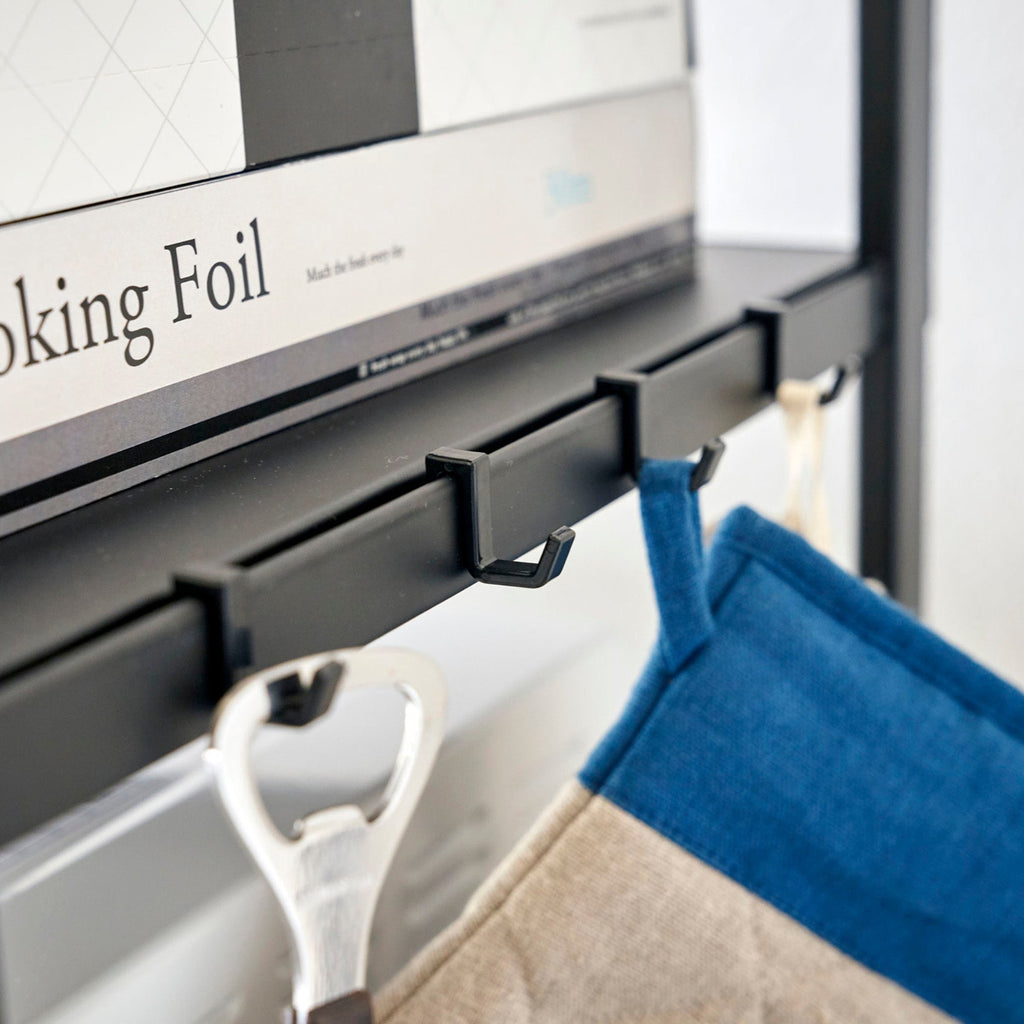 This kitchen appliance storage rack creates a dedicated space in the kitchen for your mid-sized appliances such as toaster ovens, microwaves, and blenders. The bottom compartment accommodates small refrigerators and garbage cans.
