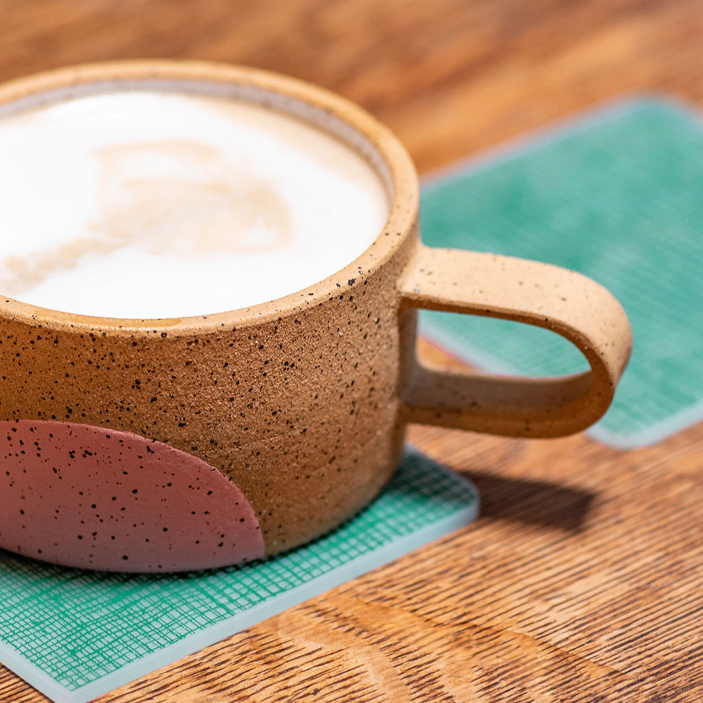 Inspired by nature & made with plastic-free silicone, the modern-twist linen print coaster set brings functional elegance directly to your table. The soft, beautifully translucent pattern enhances any surface while keeping harsh chemicals far away from your family. 
