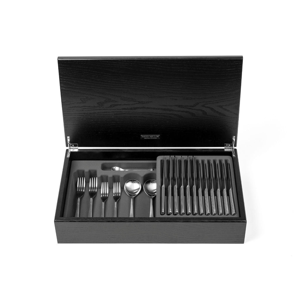 David Mellor Design Liner 44-piece cutlery canteen oak by Corin Mellor. SKU 4994312. Handmade black stained oak canteen box containing:  6 table knives 6 dessert knives 6 table forks 6 dessert forks 6 soup spoons 6 dessert spoons 6 tea spoons 2 serving spoons. 