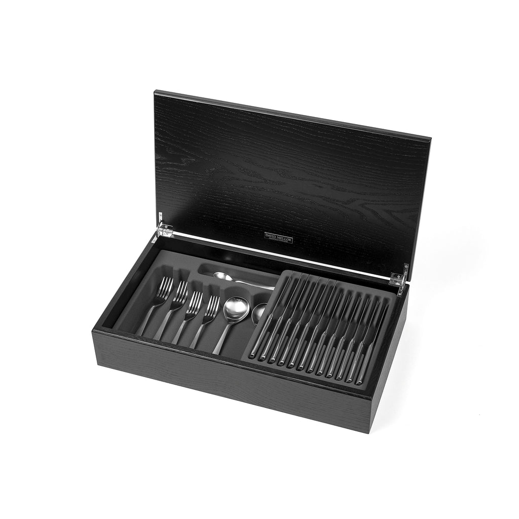 David Mellor Design Liner 58-piece cutlery canteen oak. SKU 4994326. Handmade black stained oak canteen box containing:  8 table knives 8 dessert knives 8 table forks 8 dessert forks 8 soup spoons 8 dessert spoons 8 tea spoons 2 serving spoons.