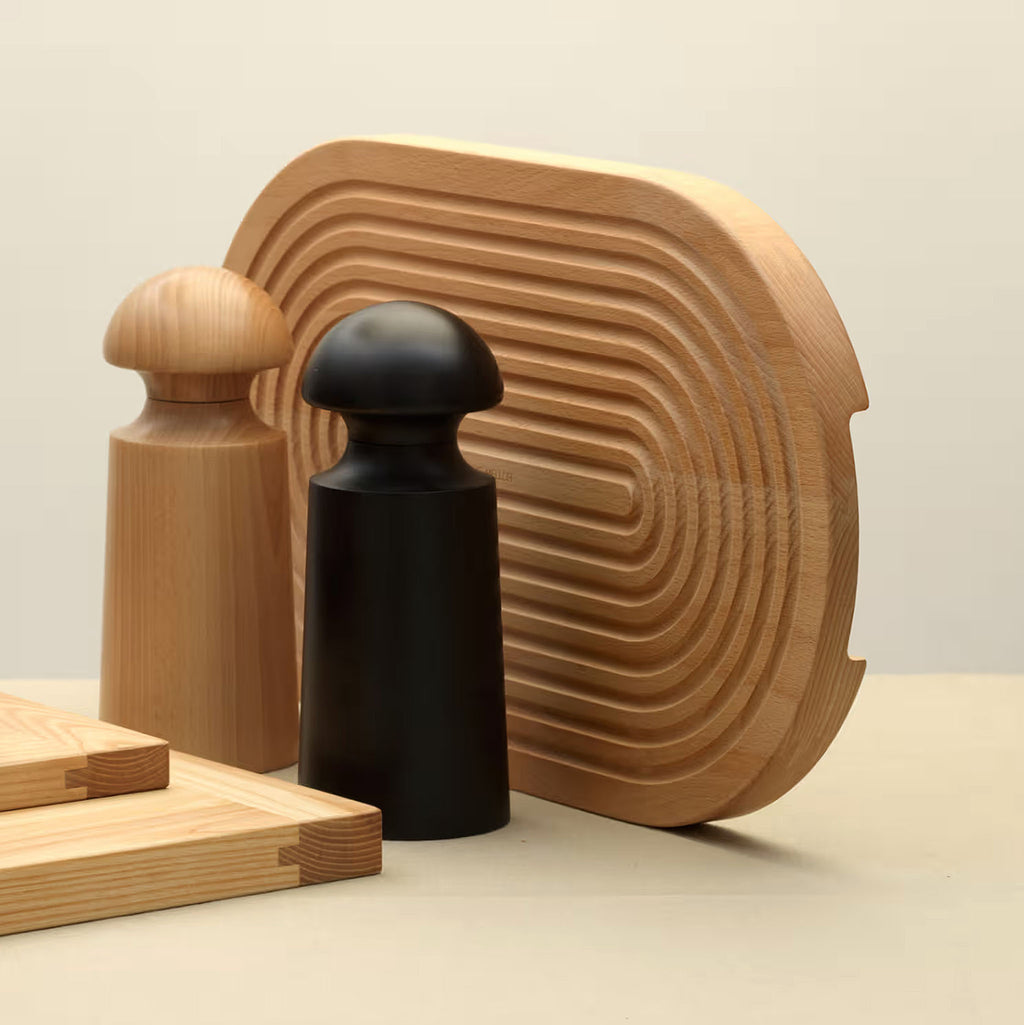 Grooved breadboard 44cm. SKU 2450310. Sculptural design with milled grooves to contain crumbs. European beech with non-slip feet. Our own-brand cutting boards are handmade in wood from sustainable sources by small specialist craft workshops. These are really top quality products.