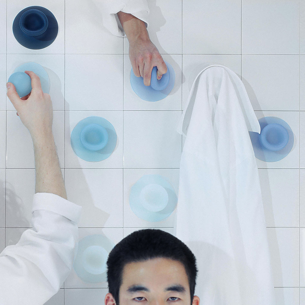 The Sucker solves the problem of having to drill holes in tiles, glass or any other smooth surface. Its beauty lies in its simplicity and the experience of attaching it to the wall: it literally sucks itself onto the surface.