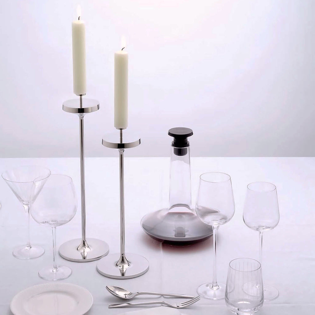 David Mellor Embassy stainless steel candlesticks. Originally designed in 1963 for use in British embassies abroad and previously only available in silver plate, we are pleased to now introduce a stainless steel version of this design classic. These spectacular candlesticks add real height and elegance to a table setting. Use individually or group together different heights.