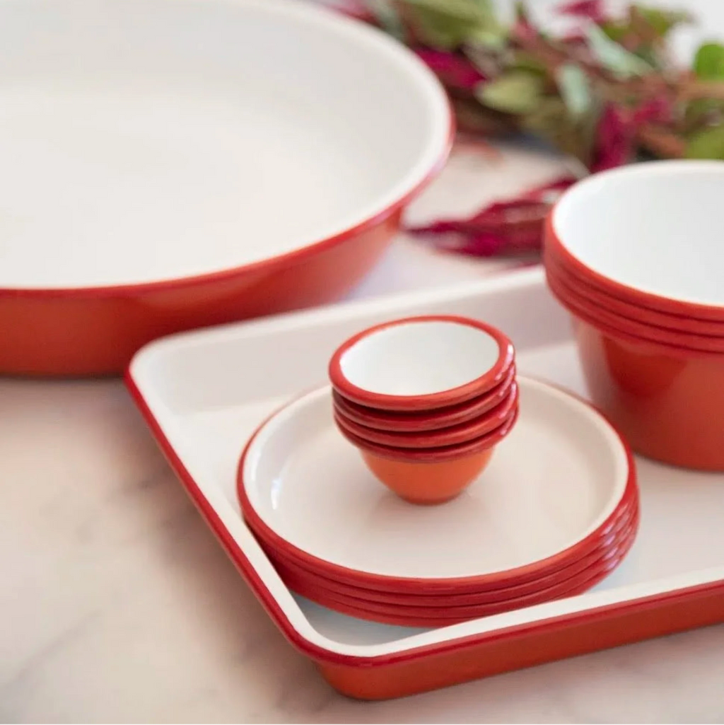 A deep sturdy enamel tray, ideal for baking or loading up with slices of cake and a pot of tea. Originally manufactured in the Black Country area near Birmingham, England, Joe Kleiner & Sons created the original enamelware brand, distinctively ice-white with the blue rim, the classic design is still instantly recognizable to this day.