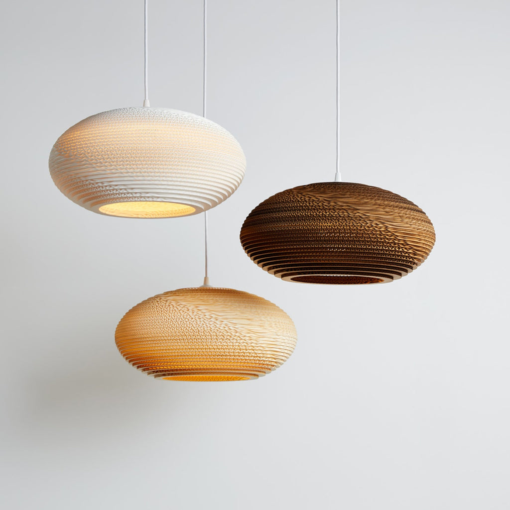 Handcrafted from recycled cardboard, Graypants flagship Scraplights provide warm, intimate, and functional lighting for any occasion or space. Tough and elegant, each is precision cut with a laser and assembled by hand using non-toxic adhesive, and all Scraplights are treated with a non-toxic fire retardant.