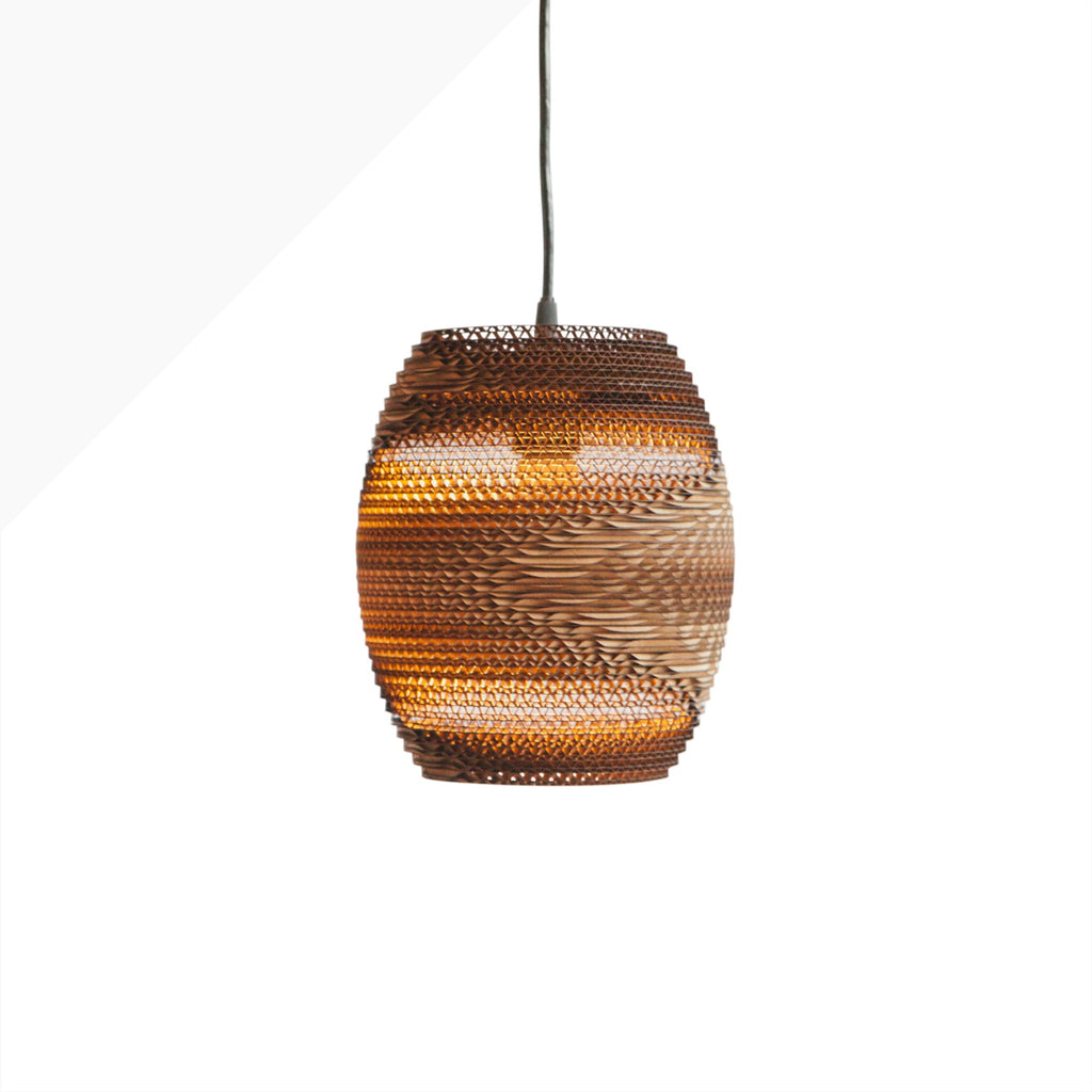 Handcrafted from recycled or pure white cardboard, Graypants’ flagship Scraplights series provides warm, intimate, and functional lighting for any occasion or type of space. Tough and elegant, each shade is precision cut with a laser (natural & blonde shades) or precision cut on advanced machinery (white shades) and assembled by hand using a nontoxic adhesive. All Scraplights are treated with an environmentally friendly fire retardant and are inscribed with the name of their artisan maker!