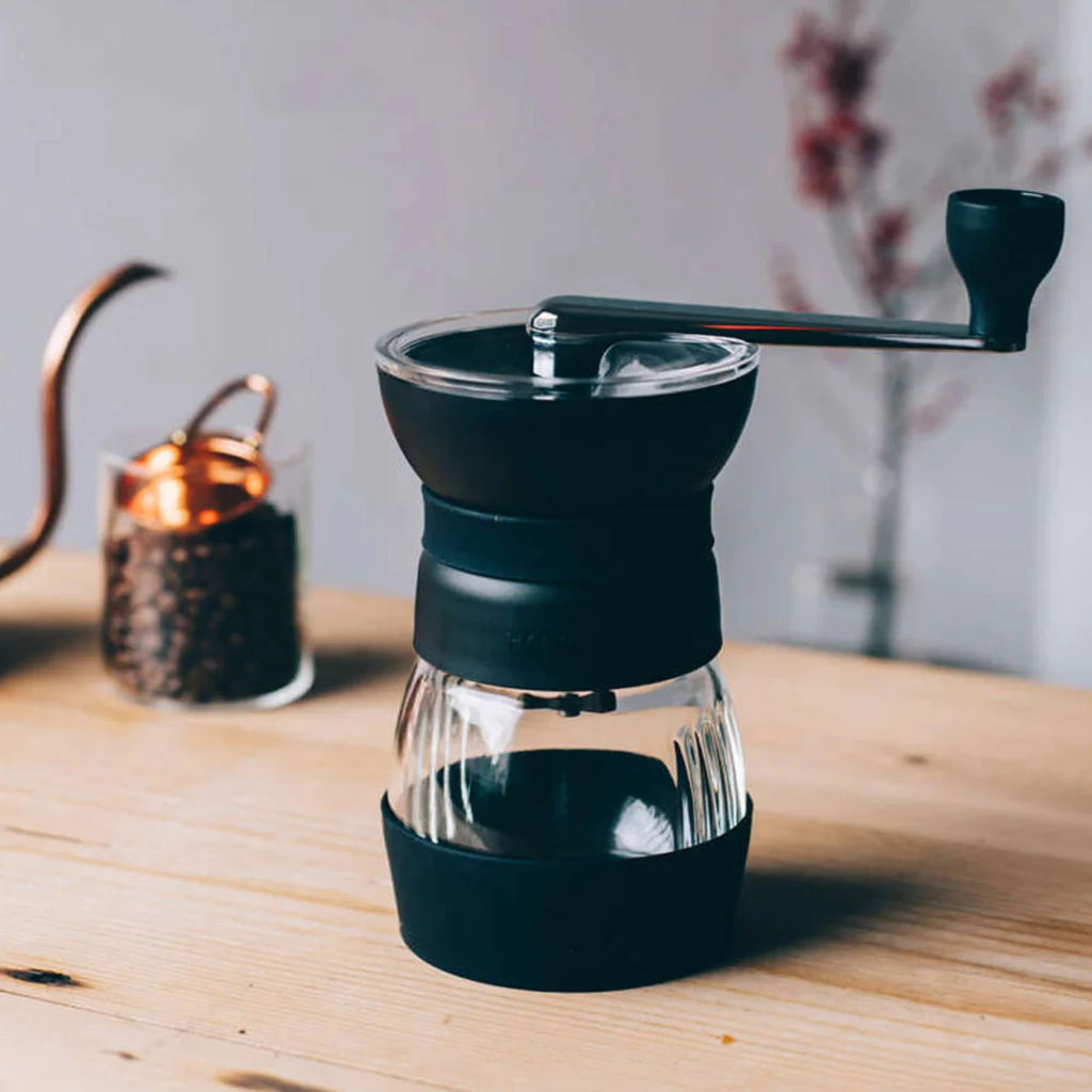 With a refined design, enhanced features, and improved comfort, the next-generation HARIO Skerton Pro makes every grind smoother and more enjoyable. Designed for versatility, this hand grinder delivers consistent results across a variety of grind styles, from pour-over to French press and beyond.

The upgraded design features a convenient hopper lid, an easy-to-attach handle, and a bottom burr adjustment knob for precise grind control. 
