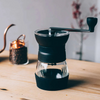 With a refined design, enhanced features, and improved comfort, the next-generation HARIO Skerton Pro makes every grind smoother and more enjoyable. Designed for versatility, this hand grinder delivers consistent results across a variety of grind styles, from pour-over to French press and beyond.

The upgraded design features a convenient hopper lid, an easy-to-attach handle, and a bottom burr adjustment knob for precise grind control. 