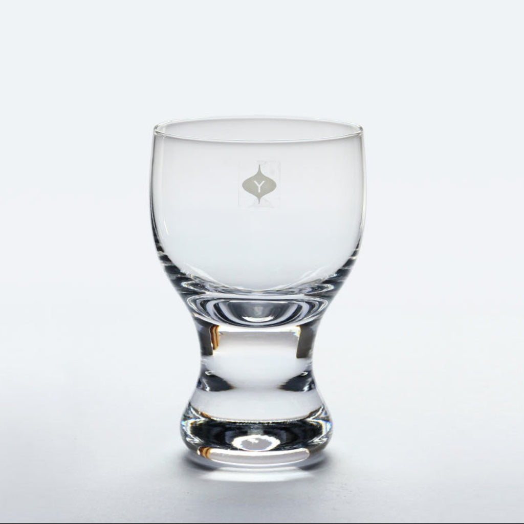 A hand-blown reissue of the 1979 design by famous industrial designer Sori Yanagi. The thick stem allows your hands to wrap comfortably around, and the heavy base sits securely on a table. The rim is slightly thicker than a traditional wine glass and the gentle curves create a flow that invites touch. More than just a wine glass, this sturdy vessel accommodates anything from a beer to a Coke float topped with ice cream. Available in both small and large sizes.