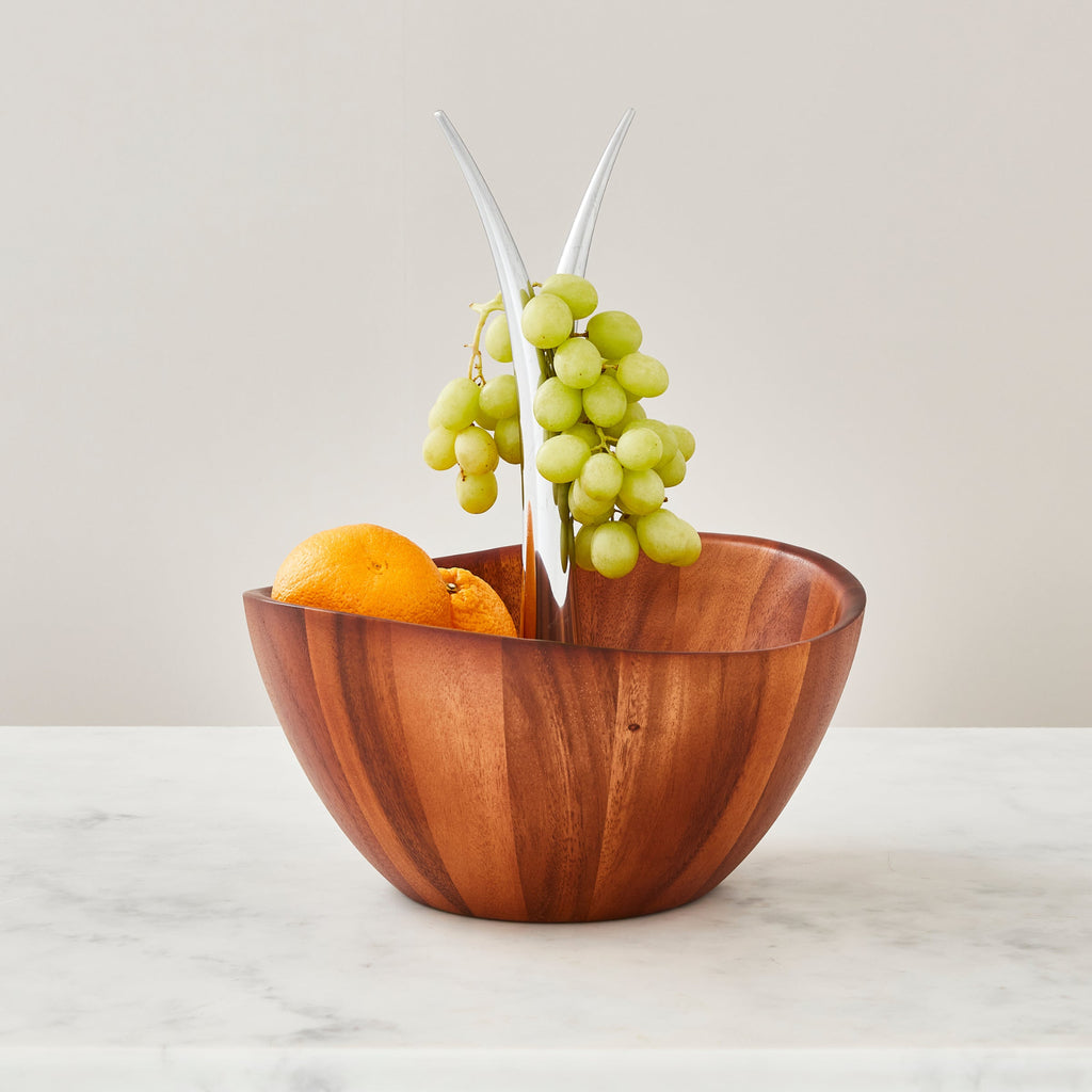 The Fruit Tree Bowl adds a delicious sense of fun and jubilation to the kitchen or dining room. Fill with seasonal produce and watch the fruit colors pop against the wood. The upward gesture of the branch centerpiece, and the shape of the bowl itself, give this unique piece an irresistibly playful spirit.