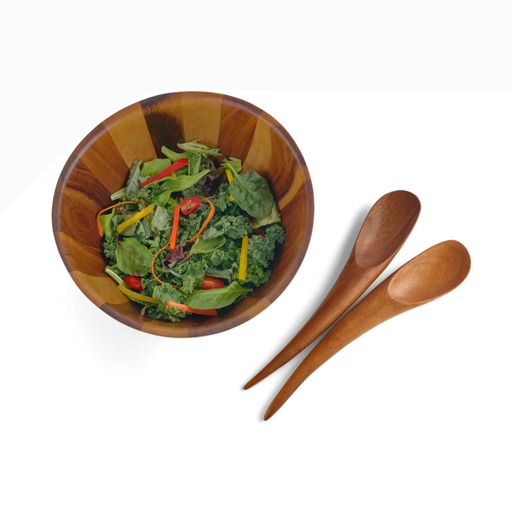 Elegant lines and flowing curves done in rich, gorgeous acacia wood make the Harmony Salad Set an instant classic. The generously rounded bowl paired with the unique shape of the tongs make it easy to toss and arrange your healthy creations.
