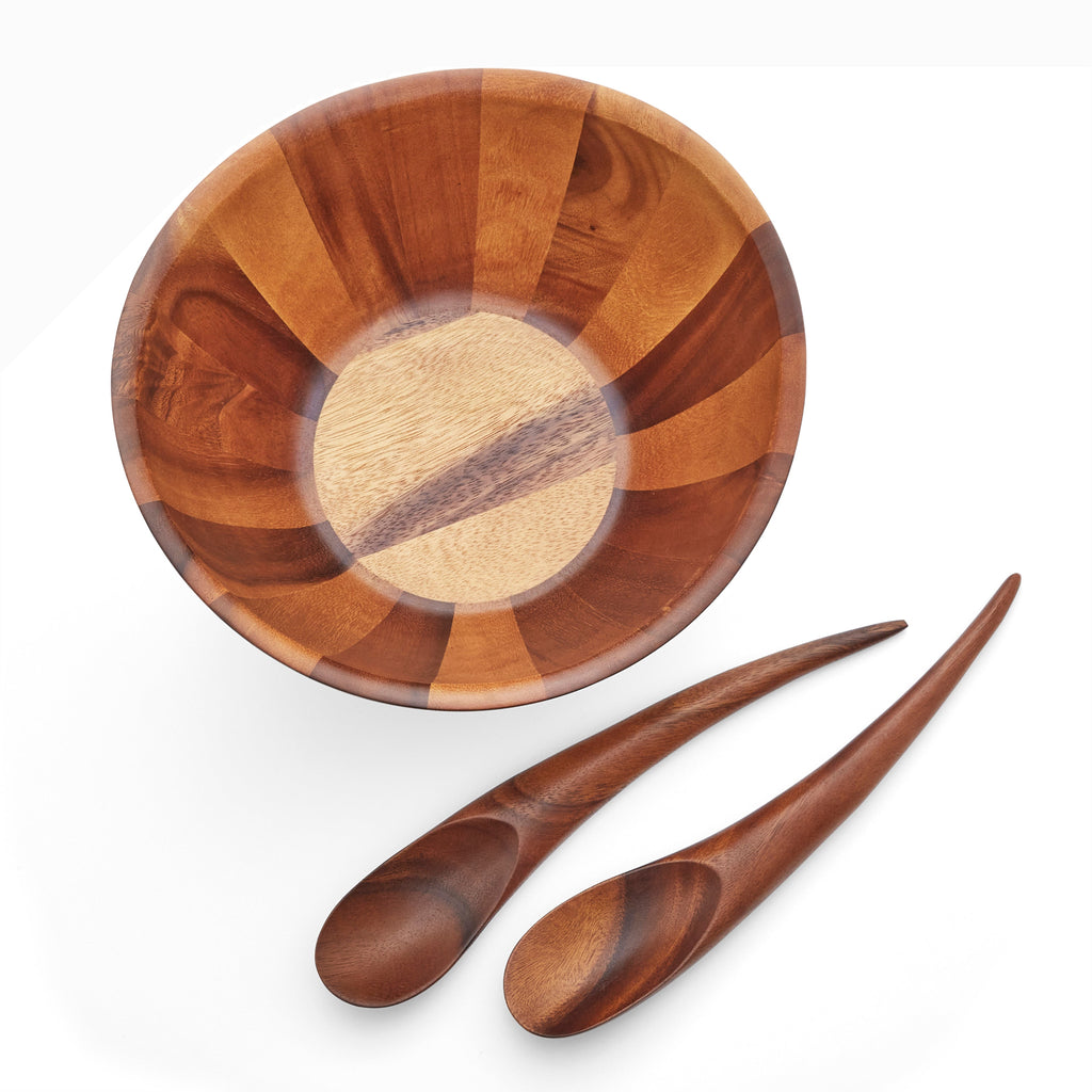 Elegant lines and flowing curves done in rich, gorgeous acacia wood make the Harmony Salad Set an instant classic. The generously rounded bowl paired with the unique shape of the tongs make it easy to toss and arrange your healthy creations.
