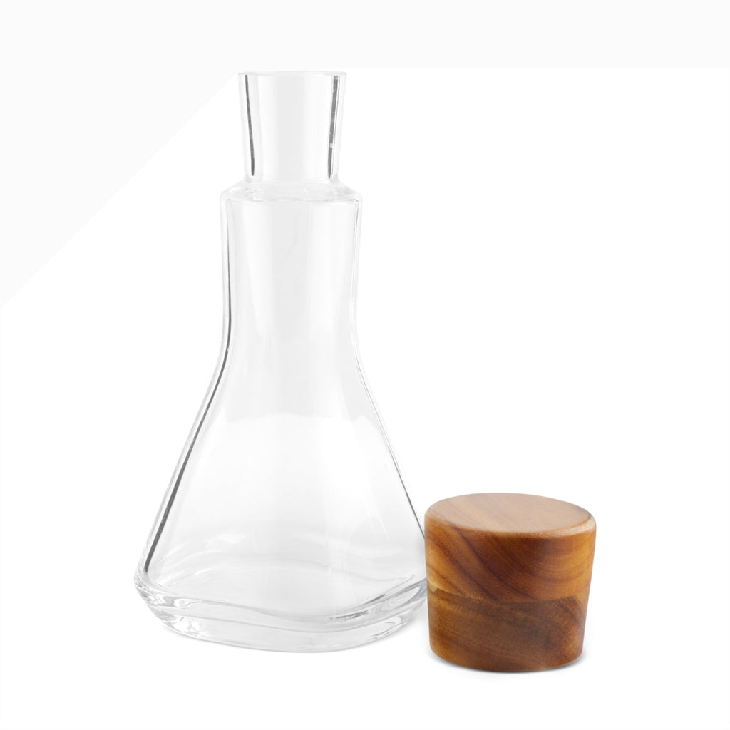 Update the classic bar with contemporary design. The combination of the Vie Decanter’s square, glass body and rounded, wood stopper make this piece a style-standout. Fill with wine, whiskey, or any other spirit and set out on your bar to be admired.