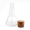 Update the classic bar with contemporary design. The combination of the Vie Decanter’s square, glass body and rounded, wood stopper make this piece a style-standout. Fill with wine, whiskey, or any other spirit and set out on your bar to be admired.
