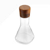 Update the classic bar with contemporary design. The combination of the Vie Decanter’s square, glass body and rounded, wood stopper make this piece a style-standout. Fill with wine, whiskey, or any other spirit and set out on your bar to be admired.