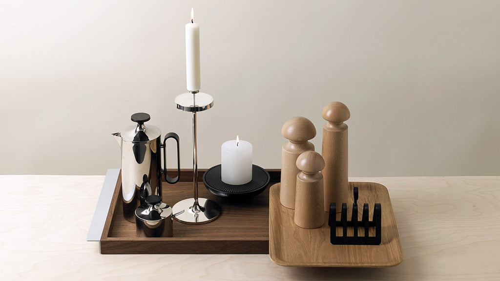 David Mellor Embassy stainless steel candlesticks. Originally designed in 1963 for use in British embassies abroad and previously only available in silver plate, we are pleased to now introduce a stainless steel version of this design classic. These spectacular candlesticks add real height and elegance to a table setting. Use individually or group together different heights.