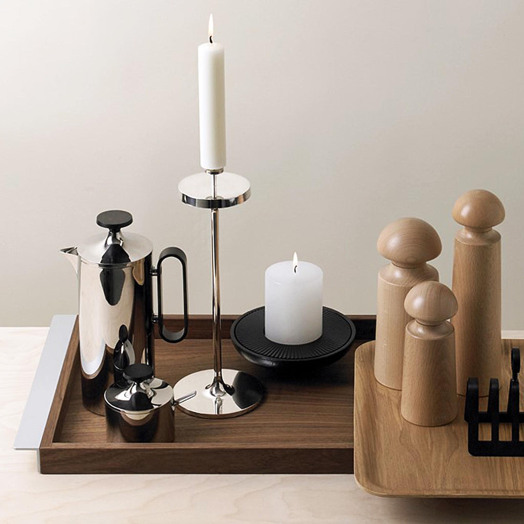 David Mellor Embassy stainless steel candlesticks. Originally designed in 1963 for use in British embassies abroad and previously only available in silver plate, we are pleased to now introduce a stainless steel version of this design classic. These spectacular candlesticks add real height and elegance to a table setting. Use individually or group together different heights.