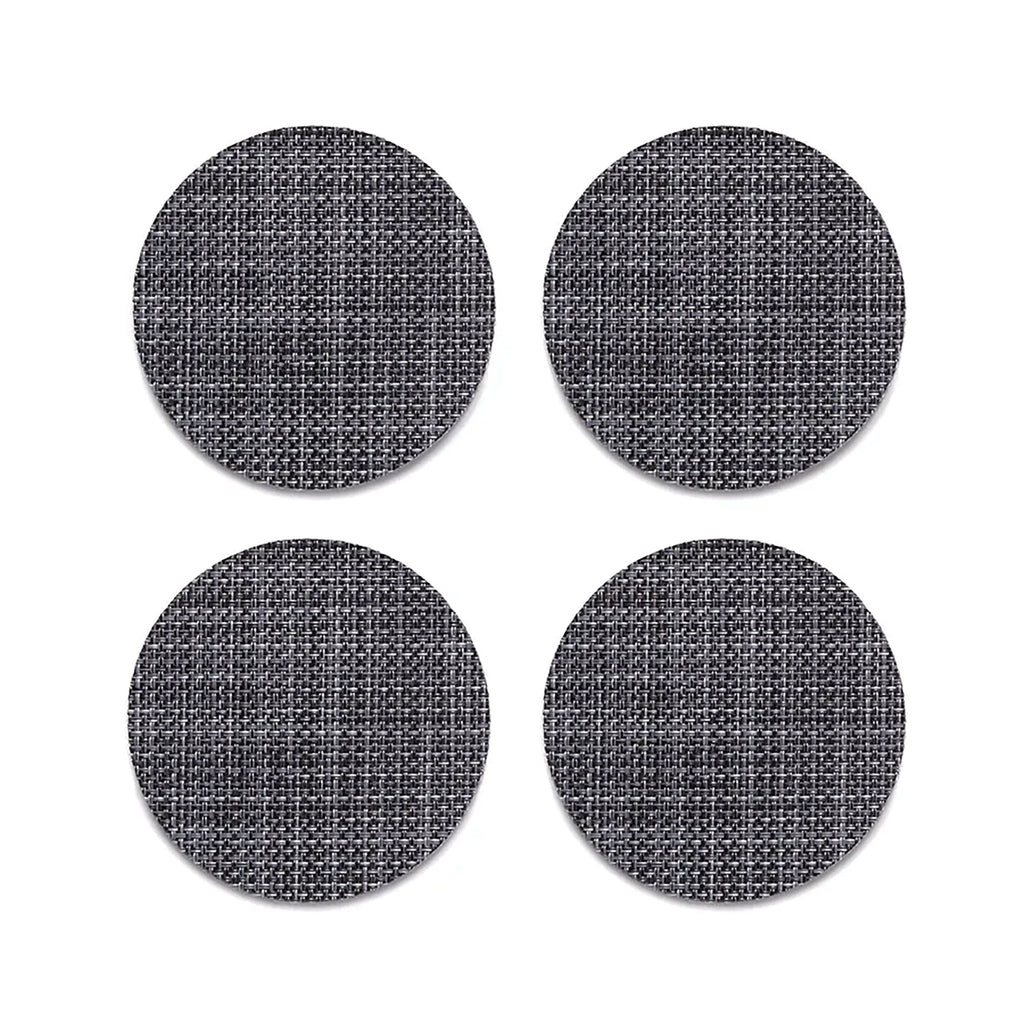 Chilewich Mini Basketweave Cool Grey Coasters (Set of 4). SKU 100743-038. A plush, protective layer of our BioFelt® backing cushions these durable yet refined coasters. Elegantly banded in sets of four, they are ready for gifting. Made from recycled fibers, the cushioned base layer protects the underlying surface from moisture. Each coaster set includes four coasters in a single color. Suitable for indoor and outdoor use. Made in the USA. Free of phthalates.