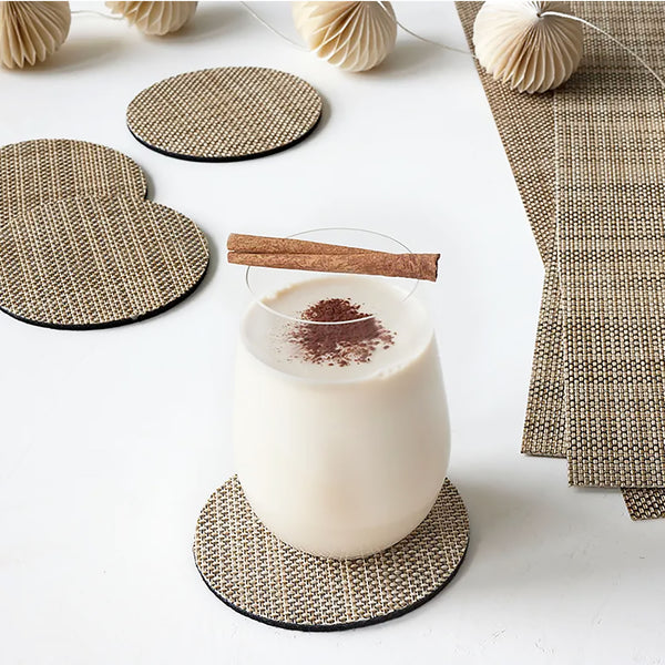 A plush, protective layer of Chilewich BioFelt® backing cushions these durable yet refined coasters. Elegantly banded in sets of four, they are ready for gifting. Made from recycled fibers, the cushioned base layer protects the underlying surface from moisture. Each coaster set includes four coasters in a single color. Suitable for indoor and outdoor use. Made in the USA. Free of phthalates.