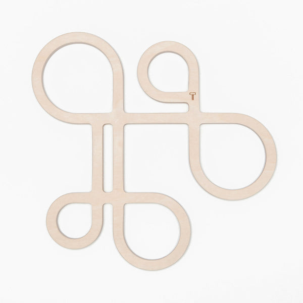 Decorate your table and protect the tablecloth with Inside Out wood trivets by Anne Thomas of TOMA Objects. Made of natural finish birch plywood. (A trivet is an object between a hot pan or serving dish and the table or countertop.) They have great heat resistance and prevent damage to surfaces caused by high heat.