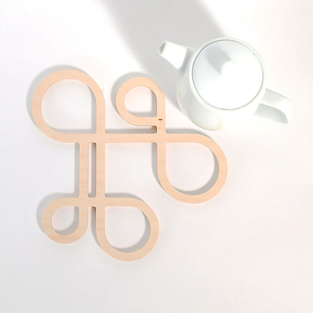 Decorate your table and protect the tablecloth with Inside Out wood trivets by Anne Thomas of TOMA Objects. Made of natural finish birch plywood. (A trivet is an object between a hot pan or serving dish and the table or countertop.) They have great heat resistance and prevent damage to surfaces caused by high heat. 