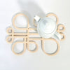 Decorate your table and protect the tablecloth with Inside Out wood trivets by Anne Thomas of TOMA Objects. Made of natural finish birch plywood. (A trivet is an object between a hot pan or serving dish and the table or countertop.) They have great heat resistance and prevent damage to surfaces caused by high heat. 