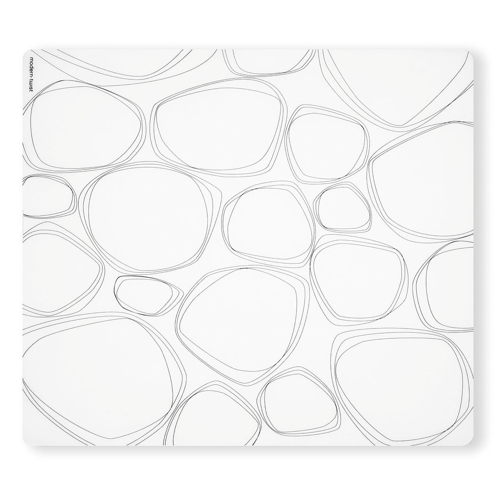 This forgiving placemat protects your surfaces from heat & water damage with silky soft, memory-free silicone that never wears or tears. The nonporous & germ-free mat repels the biggest spills & wipes clean with ease, leaving you free to enjoy the subtle designs & rich colors for many years to come. Placemat: Pebbles - Black SKU: PM021; UPC 816990015159