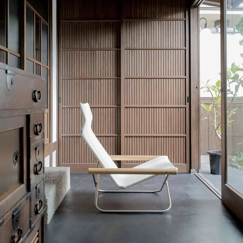 NY-103. The first, and the most iconic Nychair X model, designed in 1970.

This model has the lowest seat height and a center of gravity across all models, giving a sense of grounding. 
The chair features generous seat depth and a high back to support the whole body and allow for deep relaxation, especially when paired with an Ottoman.
