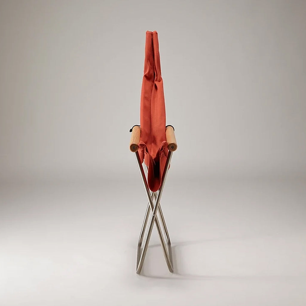 Nychair X Terracotta. SKU NY-102. The chair can be easily folded into a thickness of as little as 15-22 cm, which can still stand on its own and can be stored away into a narrow space. Folded chair can also be carried more easily, and with a weight of just 6-6.5 kg, it can be handled with ease by most users.