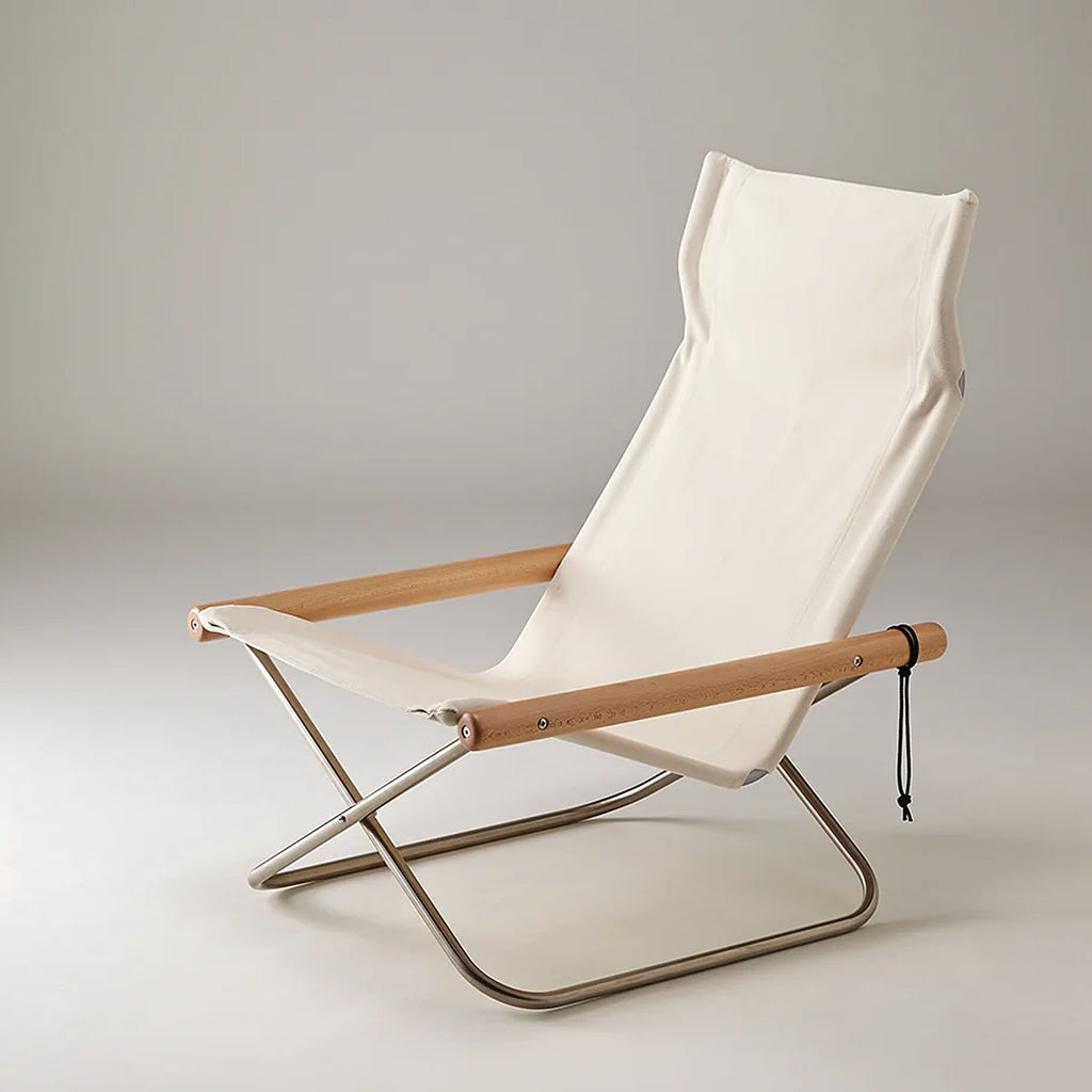 Nychair X White. SKU NY-103. This model has the lowest seat height and a center of gravity across all models, giving a sense of grounding. The chair features generous seat depth and a high back to support the whole body and allow for deep relaxation, especially when paired with an Ottoman.