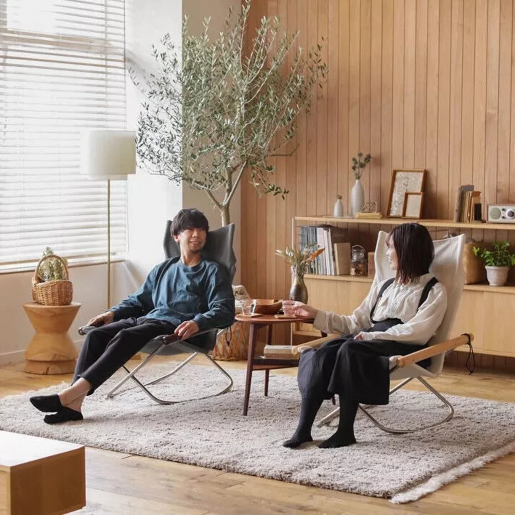 The angles and materials of each seat, armrest, and backrest are carefully crafted to support the body. The fabric adjusts itself to the shape and weight of the user's body, embracing it gently.The soft seat surface and smooth wooden armrests are pleasant to touch.