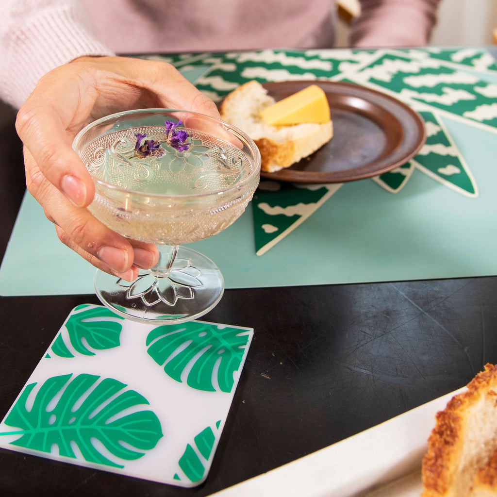 Monstera Deliciosa by Sara Strand for Modern-Twist.Bring botanical beauty to your table with this soft, beautifully translucent pattern that enhances any surface while keeping lead, latex, phthalates, BPAs, & other harsh chemicals far away from your dinner. 