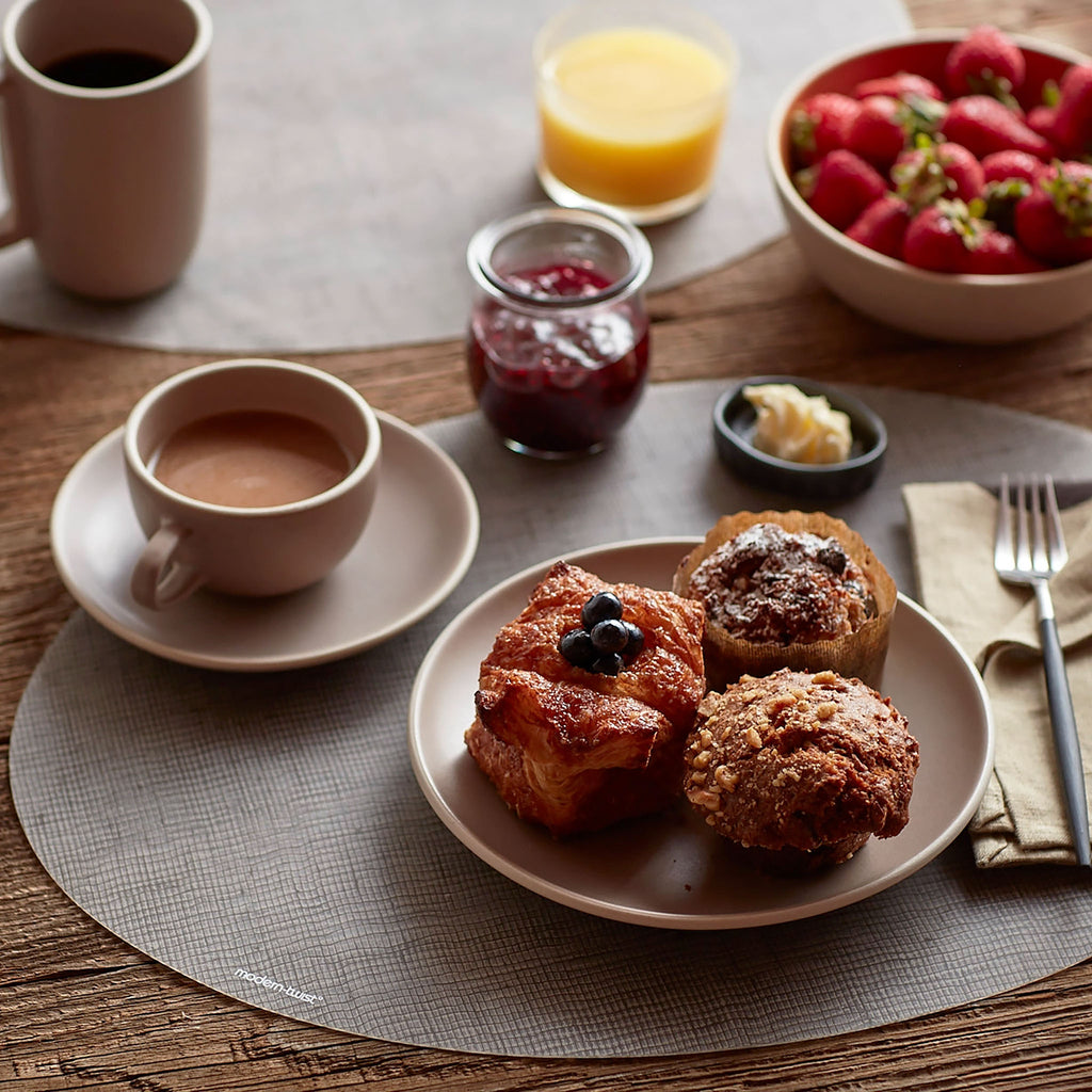 This forgiving tabletop protects your surfaces from heat & water damage with silky soft, memory-free silicone that never wears or tears. The non-porous + germ-free material repels the biggest spills + wipes clean with ease, leaving you free to enjoy the subtle designs + rich colors for many years to come.