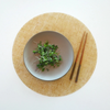 Round Placemat : Linen - Straw by Modern-Twist. Made from plastic-free silicone & hand silk-screened with nature-inspired designs, the modern-twist cocoon print placemat delivers eco-friendly, elegant style to your home. Bring botanical beauty to your table with this soft, beautifully translucent pattern that enhances any surface while keeping lead, latex, phthalates, BPAs, & other harsh chemicals far away from your dinner. This forgiving placemat protects your surfaces from heat & water damage.