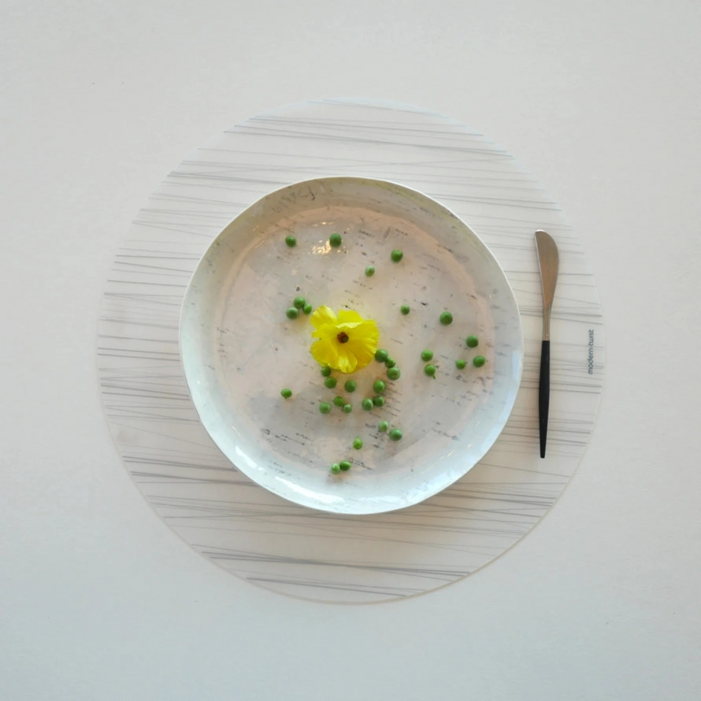Made from plastic-free silicone & hand silk-screened with nature-inspired designs, the modern-twist cocoon print placemat delivers eco-friendly, elegant style to your home. Make sure to clean spills promptly to avoid staining your Placemat & avoid punctures by keeping it away from sharp objects!
