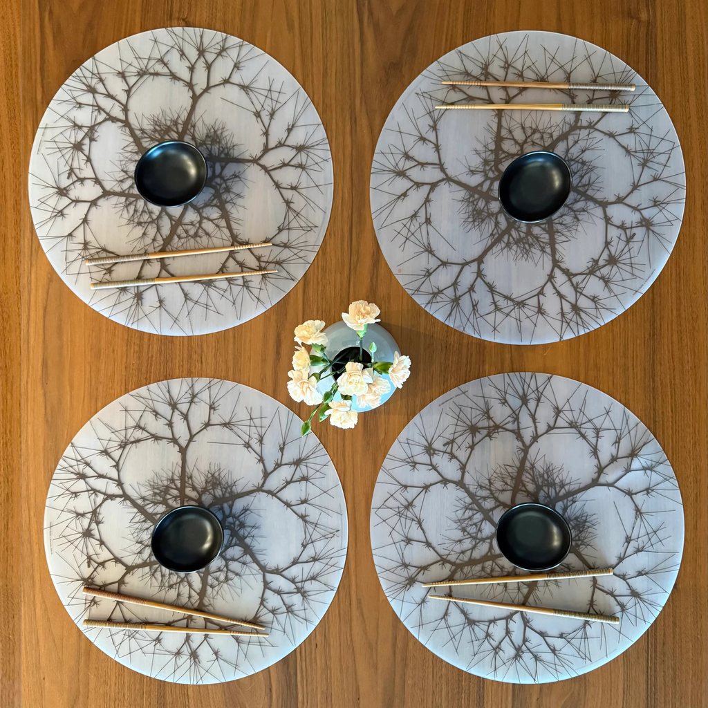Made from 100% food grade, plastic-free silicone & inspired by Ruth Asawa’s (American modernist artist) abstract looped-wire designs, the hand silk-screened modern-twist Placemat brings natural beauty to your table with its soft, beautifully translucent pattern that enhances any surface while keeping lead, latex, phthalates, BPAs, & other harsh chemicals far away from your food. 