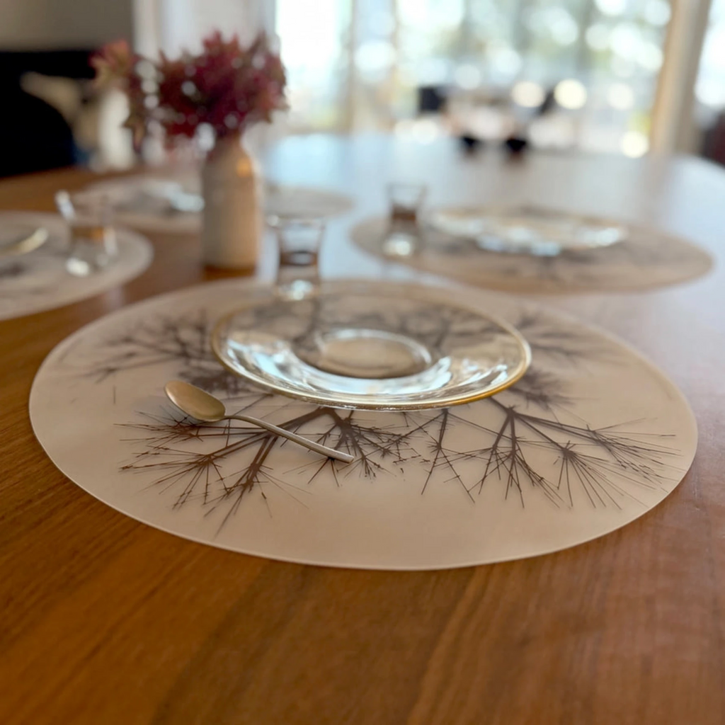 Bring botanical beauty to your table with this soft, beautifully translucent pattern that enhances any surface while keeping lead, latex, phthalates, BPAs, & other harsh chemicals far away from your dinner. This forgiving placemat protects your surfaces from heat & water damage with silky soft, memory-free silicone that never wears or tears. The non-porous & germ-free material repels the biggest spills & wipes clean with ease, leaving you free to enjoy the subtle designs & rich colors for many years to come
