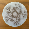 Modern-Twist Round Placemat : Asawa Nest. UPC# 854796002362. All modern-twist products are made with 100% pure, food-grade silicone that is European & FDA compliant. Bring botanical beauty to your table with this soft, beautifully translucent pattern that enhances any surface while keeping lead, latex, phthalates, BPAs, & other harsh chemicals far away from your dinner. 