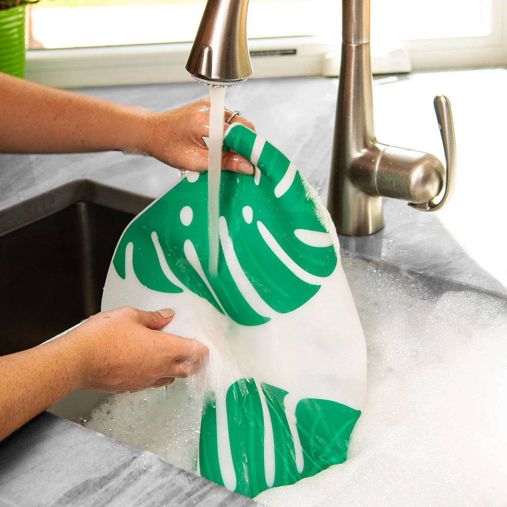 Modern-Twist Silicone Placemat : Monstera Deliciosa by Sara Strand. The non-porous & germ-free material repels the biggest spills & wipes clean with ease, leaving you free to enjoy the subtle designs & rich colors for many years to come.